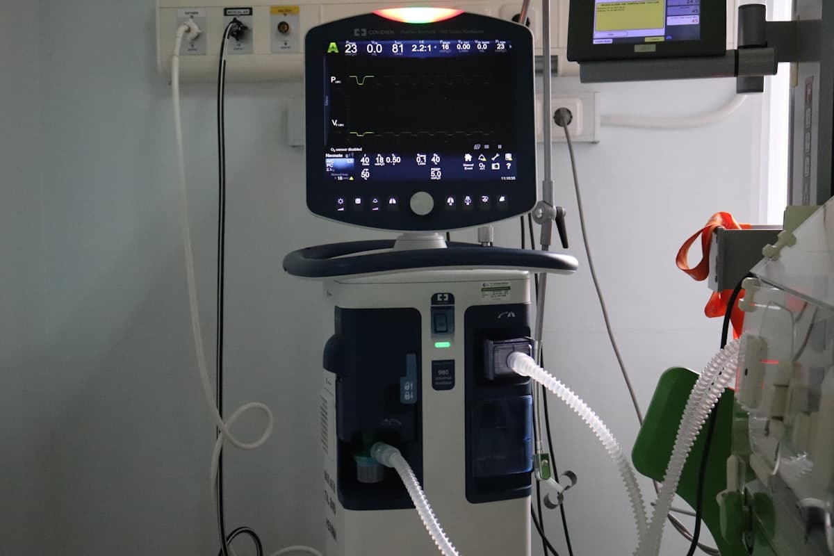 ICU mechanical ventilator with touchscreen display mounted on a stand